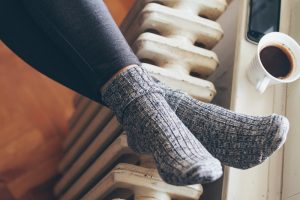 warming-feet-at-radiator