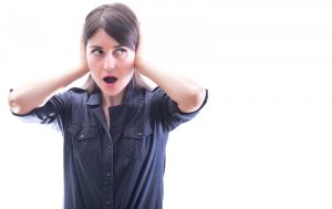 woman-covering-ears-to-shut-out-loud-noises